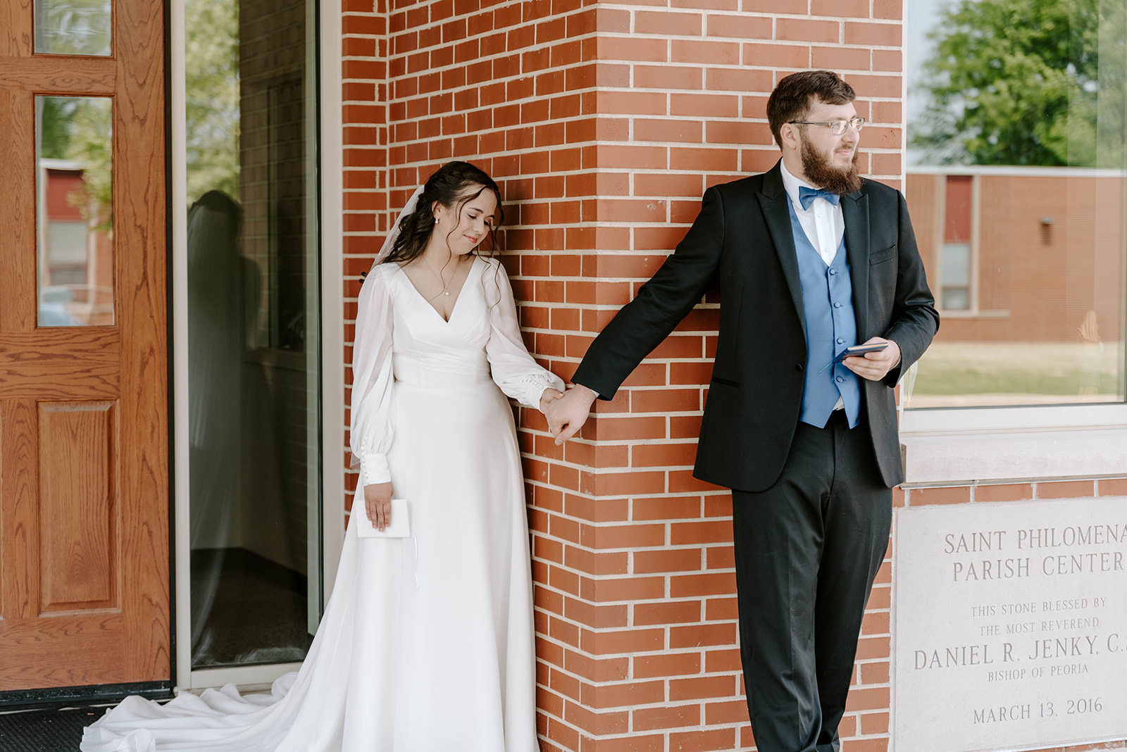 Bride and groom having a first touch.